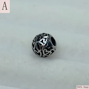 Close-up of vintage stainless steel hollow heart charm bead for DIY jewelry, 9x9.8mm