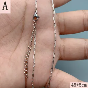 Detailed macro shot of stainless steel necklace chain with lobster clasp and extension