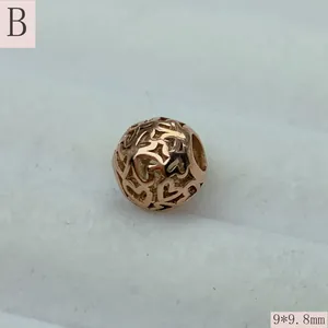 Detailed macro view of a rose gold stainless steel hollow heart bead at 9x9.8mm