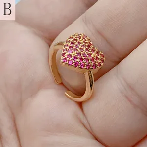 Macro detail of a vintage style heart-shaped open ring with micro-set pink zircon stones