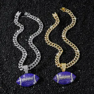 Detailed view of silver and gold iced-out Cuban chains with blue football pendants.