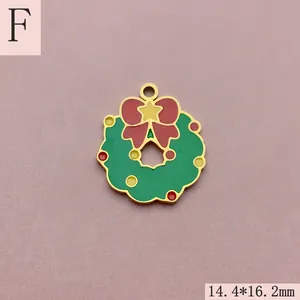 Detailed view of a colorful enamel Christmas wreath charm with a red bow and star