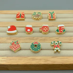 Detailed macro shot of various festive enamel Christmas charms for DIY jewelry making