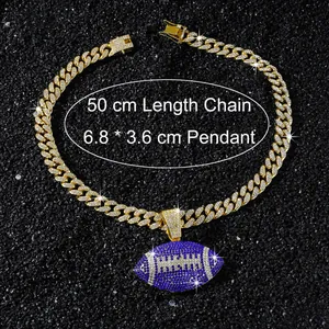 Detail view of the 50cm gold Cuban chain and the blue iced out football pendant