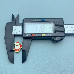 Detail shot of Santa Claus charm measured at 11.8mm width with a digital caliper