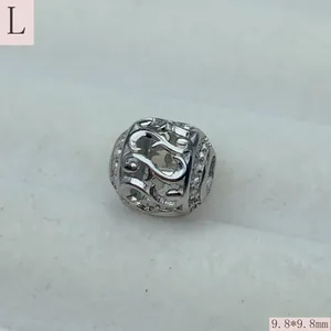 Close-up detail of silver vintage hollow stainless steel large hole charm bead 9.8mm
