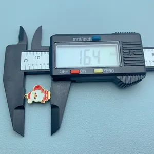 Detail view showing a 16.4mm Christmas Santa Claus charm measured by digital caliper