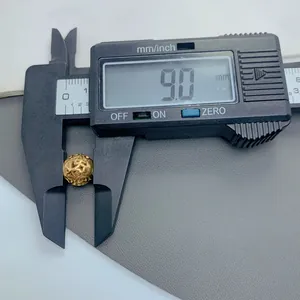 9.0mm diameter stainless steel hollow circular spacer bead measured by digital caliper