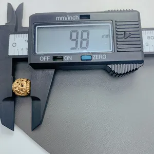 Detail shot of 9.8mm vintage stainless steel hollow bead measured by digital caliper