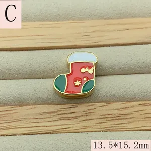 Close-up detail of a festive red and green Christmas sock enamel bead charm, 13.5x15.2mm