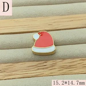 Detailed macro view of a red and white enamel Christmas Santa hat DIY jewelry charm bead