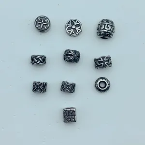 Macro view of various antique silver stainless steel decorative spacers for DIY jewelry making