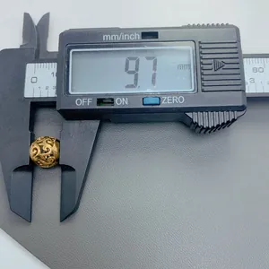 Detailed measurement of retro gold hollow stainless steel bead showing 9.7mm size