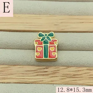 Detailed macro view of a red enamel Christmas gift box charm bead with heart patterns