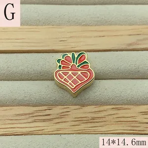 Detail of Christmas themed red and green enamel charm bead measuring 14x14.6mm