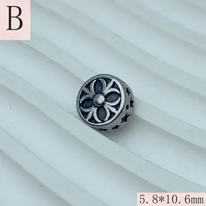 Detailed macro view of a vintage style stainless steel star spacer bead for DIY jewelry