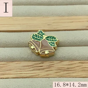 Detail of enamel Christmas bell charm with holly leaves for DIY jewelry making 16.8mm