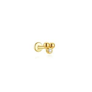 Dettaglio di un orecchino piercing 16G in argento S925 dorato con tre sfere e cristallo