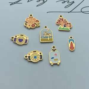 Macro detail of diverse stainless steel enamel charms featuring mushroom and camera designs