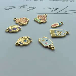 Detailed shot of enamel beach-themed stainless steel charms including mushroom and camera