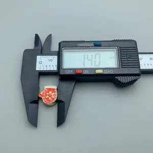 Detailed size measurement of red Christmas mitten enamel bead showing 14mm width