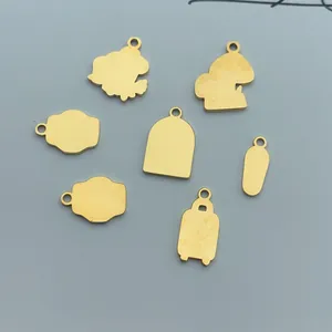 Selection of gold stainless steel pendants in mushroom and camera shapes for DIY jewelry making.