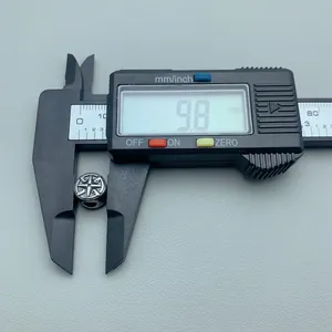 Close-up of 9.8mm stainless steel star spacer bead measured with digital caliper