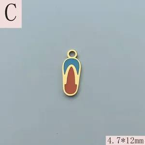 Detailed macro view of gold-plated enamel flip-flop pendant charm measuring 4.7x12mm