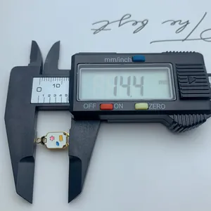 Detailed measurement of camera pendant showing 14.4 mm width with digital caliper