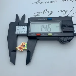 Detail showing 14.6mm measurement of a colorful enamel mushroom pendant