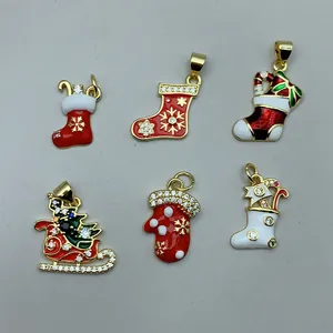 Detail view of colorful Christmas charms including stockings sleigh and mitten with CZ stones