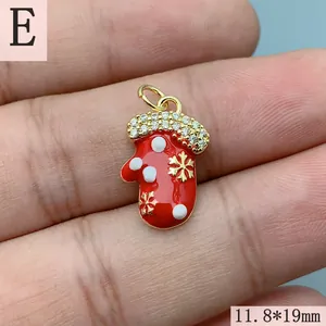 Detailed view of red enamel Christmas mitten pendant with sparkling CZ stones and size mark