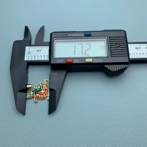 Digital caliper measuring a Christmas stocking pendant showing 17.2mm detail size.