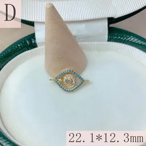 Close-up of gold evil eye jewelry connector with blue beads and zircon, 22.1*12.3mm