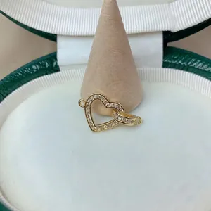 Close-up of a gold heart-shaped pendant with cubic zirconia for DIY jewelry projects