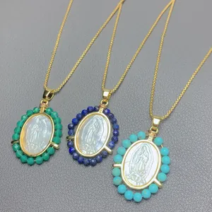Detail showing three Guadalupe necklaces with mother-of-pearl insets and natural stone beads