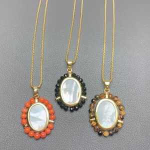 Detailed view of three mother-of-pearl necklaces with colorful gemstone beads