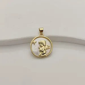 Close-up of golden praying angel pendant with iridescent white mother of pearl inlay