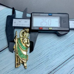 Detailed measurement of gold St. Jude pendant with green zircon stones showing 25mm width