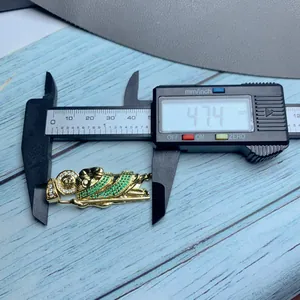 Detailed view of St. Jude pendant length measurement at 47.4mm with green zirconia.