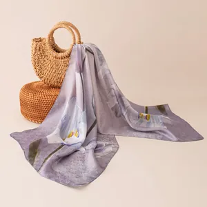 Close-up of elegant purple floral mulberry silk scarf with delicate texture and sheen