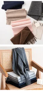 Detailed view of high-quality solid color wool scarves with elegant tassel fringe
