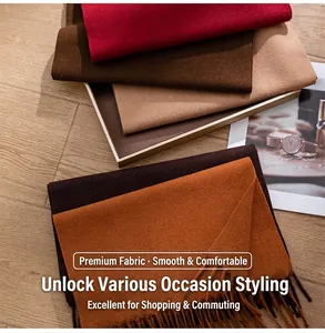 Close-up of soft solid color wool scarves with fringe details in warm fall tones