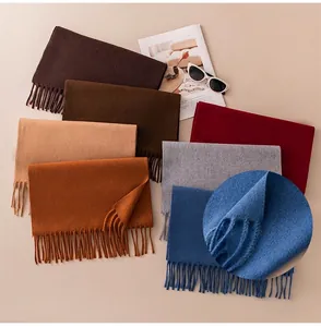 Close-up detail showing the durable fiber and fine tassel finish of the solid color scarf.