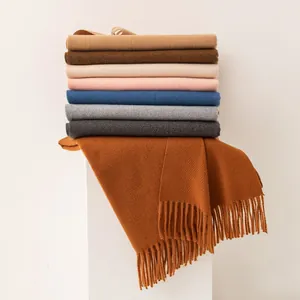 Collection of elegant solid color wool blend scarves with fringe tassels for winter.