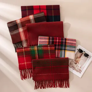 Assorted plaid winter scarves with fringe for men and women, cozy autumn shawl collection.