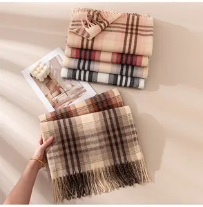 Assortment of cozy plaid imitation cashmere scarves with elegant fringe details