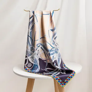 Detailed macro view of the 16mm twill mulberry silk scarf featuring elegant prints