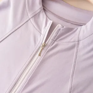Detail of lilac lightweight sun protection jacket with stand collar and white zipper