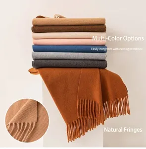 Detailed view of multi-color solid wool scarves featuring elegant tassel fringe edges